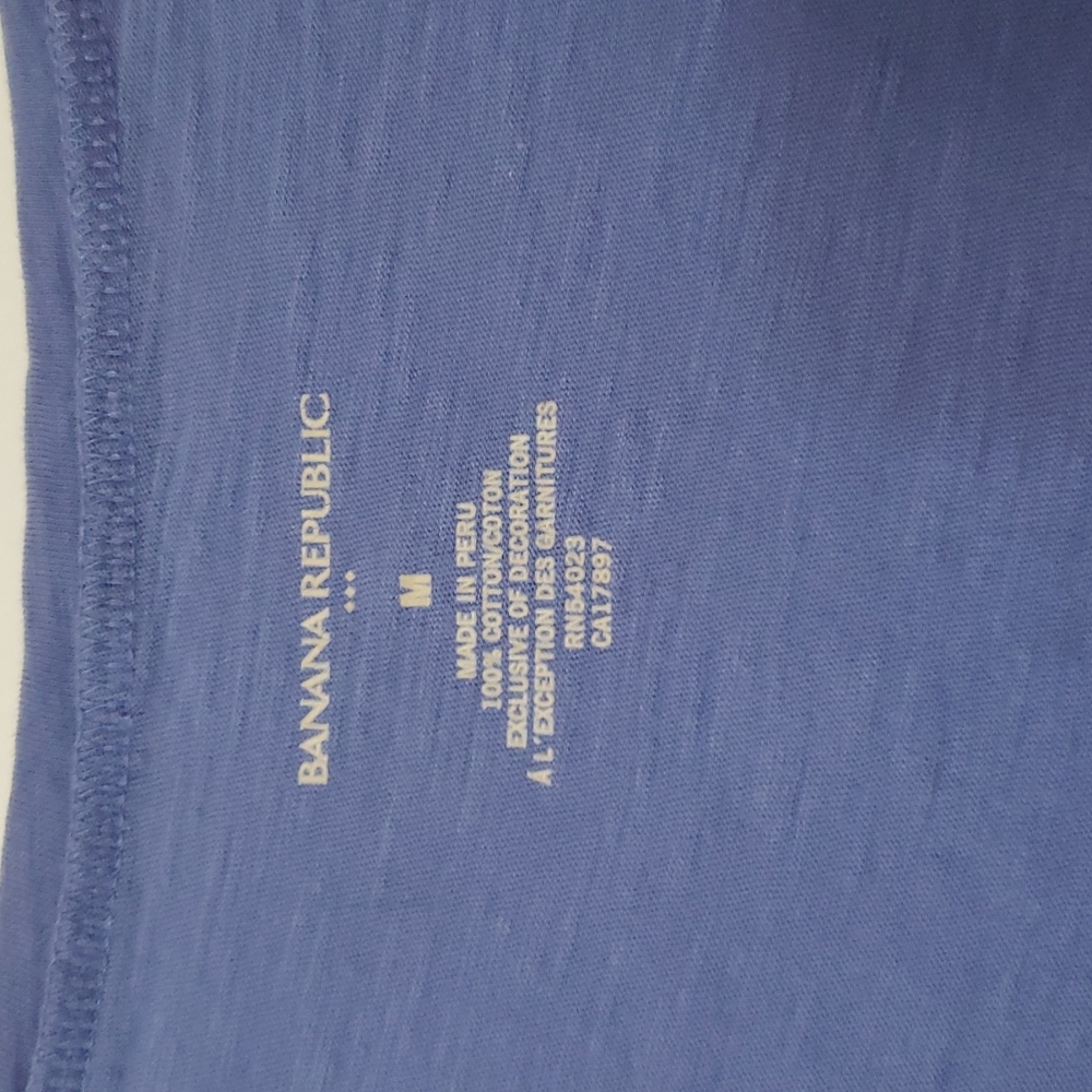 Banana Republic sky blue tee shirt with silver medallion design.